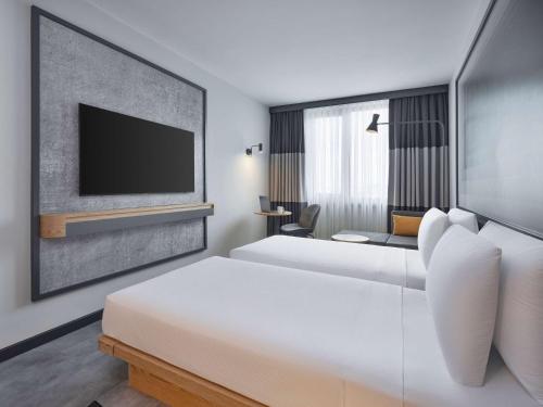 Ένα ή περισσότερα κρεβάτια σε δωμάτιο στο ibis Istanbul Sisli