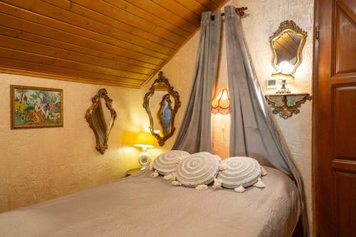 a bedroom with a bed with towels on it at Fortuna Eco - Boutique Hotel in Băile Tuşnad