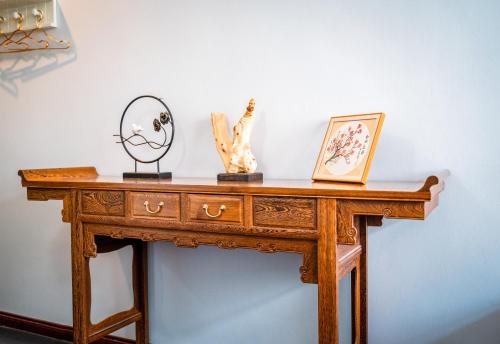 a wooden table with some items on top of it at Xi'an See Tang Guesthouse in Xi'an