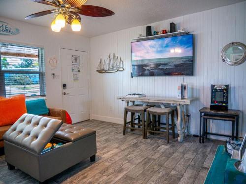 a living room with a couch and a table at Sunny Delight I in Cape Canaveral