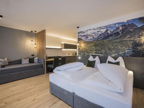 Posteľ alebo postele v izbe v ubytovaní Studio Montanaris Alpine Active Relax-3 by Interhome