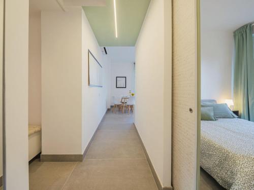 a hallway leading to a bedroom with a bed at Apartment Giacomo by Interhome in Sori