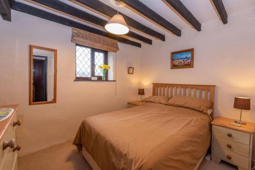Postel nebo postele na pokoji v ubytování Byre Cottage