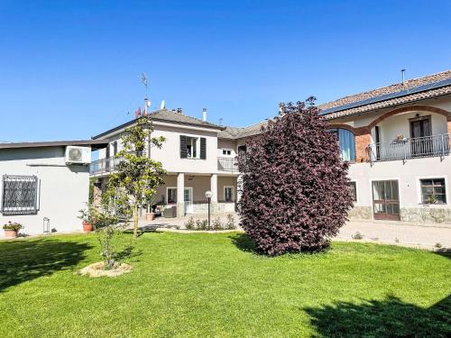 a large bush in the yard of a house at Apartment Viola by Interhome in CastellʼAlfero