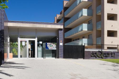 aartment building with a door and a sign on it at Ibersol Spa Aqquaria in Salou