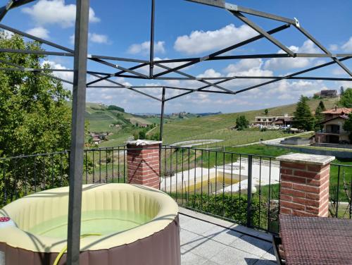 a balcony with a view of a hill at La Terrazza del Barbaresco in Neviglie