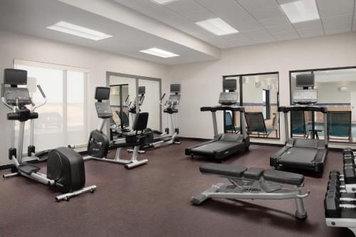 a gym with a lot of treadmills and machines at TownePlace Suites by Marriott Cheyenne Southwest/Downtown Area in Cheyenne