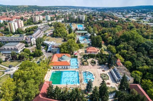 an aerial view of a resort with a swimming pool at Indium City Panzió in Eger