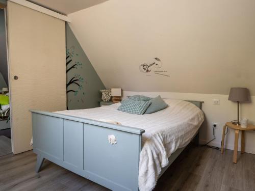 a bedroom with a bed with a dresser at Holiday Home Roucan by Interhome in Teyssieu