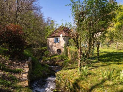 an old house in the middle of a stream at Holiday Home Roucan by Interhome in Teyssieu