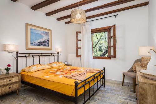 a bedroom with a large bed in a room at Stone Nest in Samos