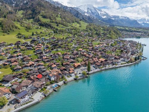 an aerial view of a town next to the water at StayBrienz - Lake Brienz Family Holiday Apartment in Brienz