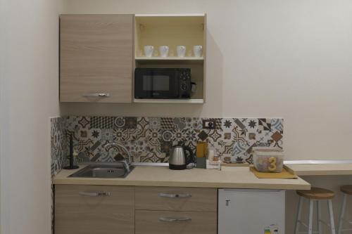 Η κουζίνα ή μικρή κουζίνα στο Tinellari Rooms