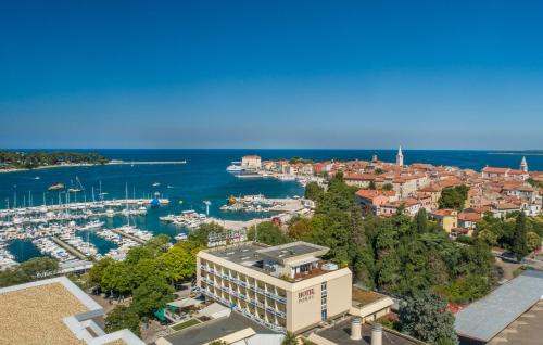 an aerial view of a city with a marina at Hotel Porec in Poreč