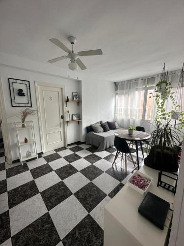 a living room with a checkered floor at Habitación 3 - 3 planta sin ascensor in Fuengirola