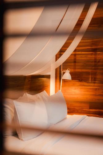 Ein Bett oder Betten in einem Zimmer der Unterkunft Portare.home