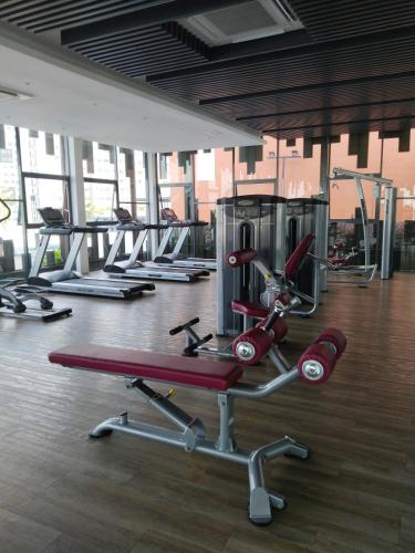 a gym with several treadmills and other machines at Comfortable18 3R2B 7pax Meritus Perai in Perai