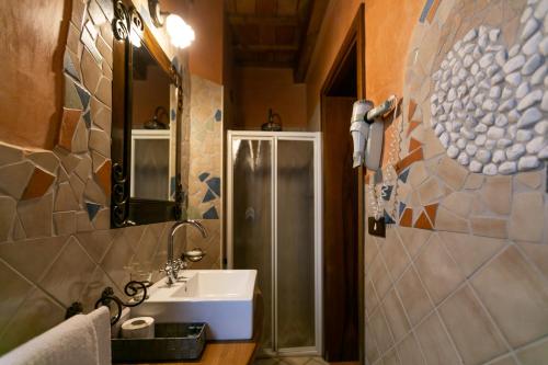 a bathroom with a sink and a shower at Il Podere Del Germano Reale in Coriano