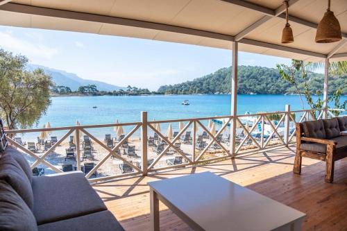 a living room with a view of the water at Beach 222 Oludeniz in Fethiye