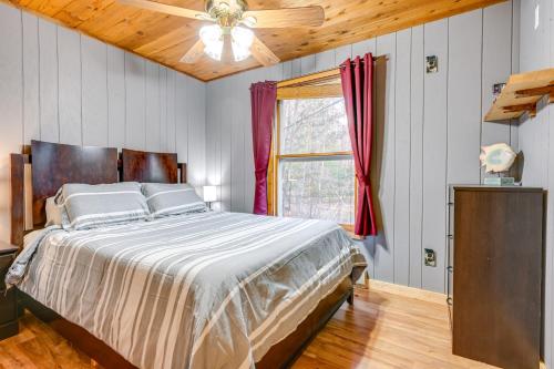 um quarto com uma cama grande e uma janela em Lake Home with Private Dock Steps to Sandy Beach! em Lake
