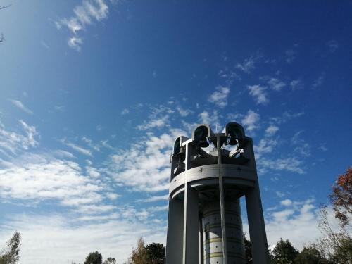a roller coaster with a blue sky in the background at Yukiumi House in Kamikawa