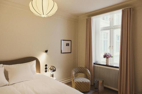 Postel nebo postele na pokoji v ubytování Hotel Bella Grande