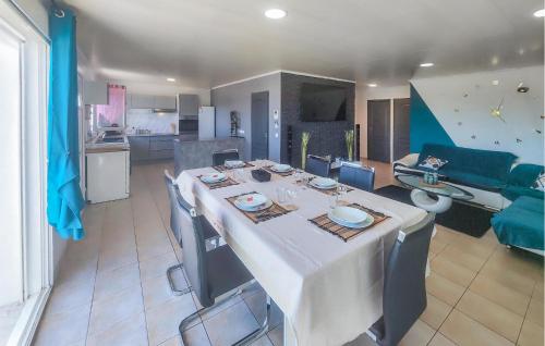 a room with a dining table and a living room at Lovely Home In Villespassans With Wifi in Villespassans