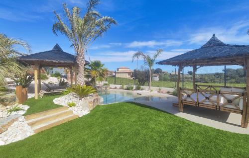 a backyard with a pool and a gazebo at Lovely Home In Villespassans With Wifi in Villespassans