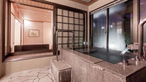 Koupelna v ubytování U-BELL Hotel Matsumasa