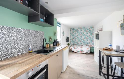 a kitchen with a sink and a counter top at Stunning Apartment In Amblainville in Amblainville