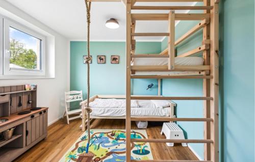 a kids room with a bunk bed and a swing at Lovely Home In Lembruchdümmer See in Lembruch