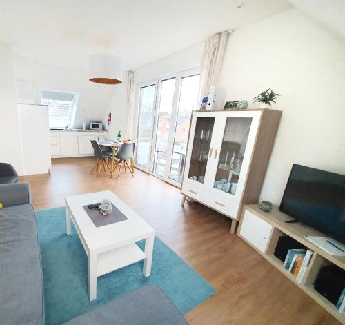 TV a/nebo společenská místnost v ubytování Ferienwohnung Beste - für eine entspannte Auszeit
