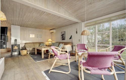a living room with chairs and a table and a couch at Beautiful Home In Blåvand With Wifi in Blåvand