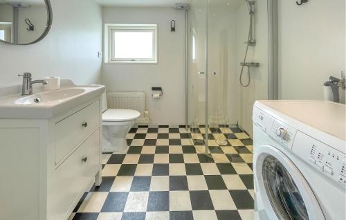 a bathroom with a sink and a washing machine at 3 Bedroom Lovely Home In Varberg in Varberg