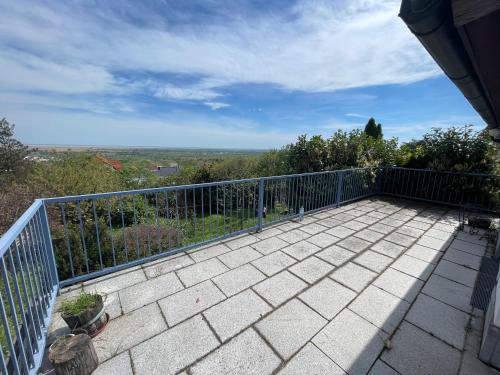 a balcony of a house with a fence at Villa Vista Pannonia in Donnerskirchen