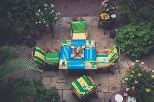 an overhead view of a table and chairs in a garden at Mukima Manor in Nanyuki