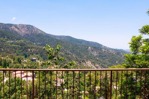 a balcony with a view of a mountain at Stella's Country House in Prodromos