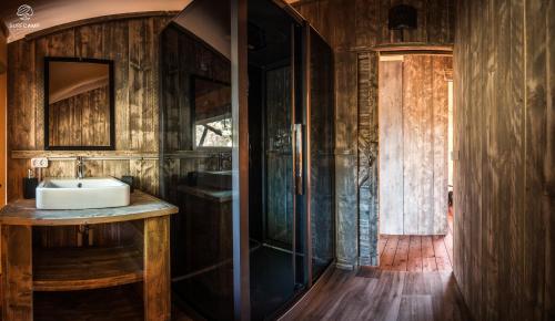 a bathroom with a sink and a shower at Oasis Camp Portugal in Lagoa