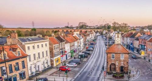 an aerial view of a city street with cars at Yarm Luxury Apartments - Bank House - private gated carpark in Yarm