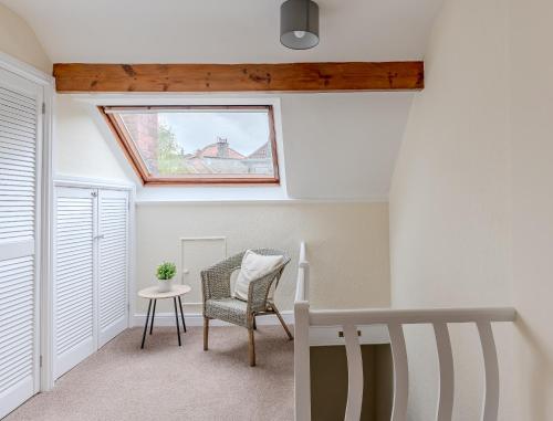 a skylight in a room with a chair and a table at Esk Valley House in Sleights