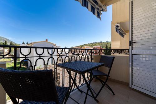 a balcony with a table and chairs and a view at Villa Jadranka Sutomore in Sutomore
