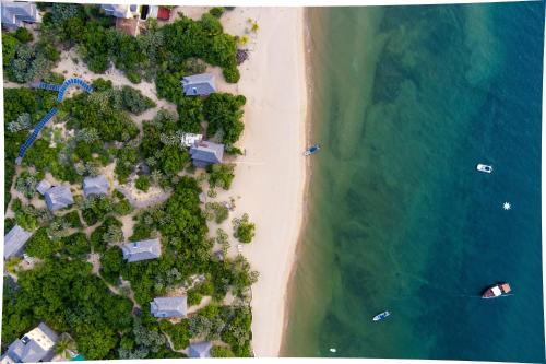 an overhead view of a beach and the ocean at The Cabanas Lamu in Lamu