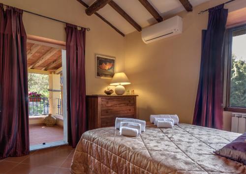 Postel nebo postele na pokoji v ubytování Villa Poggio Di Gaville