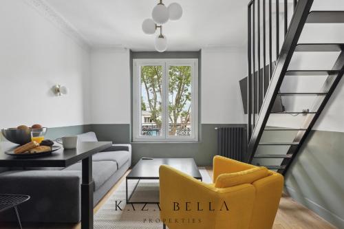 a living room with a yellow chair and a staircase at KAZA BELLA - Maisons Alfort 3 Modern flat in Maisons-Alfort