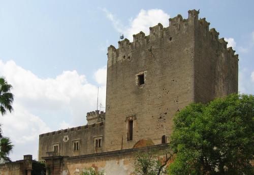 an old castle sitting on top of a building at UNICO Albatres Palace Salento by Life Resorts in San Vito dei Normanni