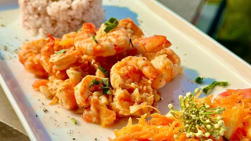 a plate of shrimp and rice on a plate at Ceylon's House in Hikkaduwa