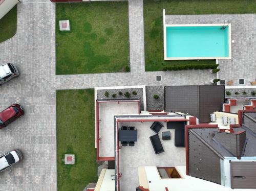 an aerial view of a yard with a swimming pool at Grand Vista Apartman in Palić