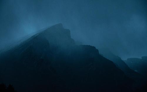 a foggy view of a mountain in the distance at As Fuebas de Patricio in Vío