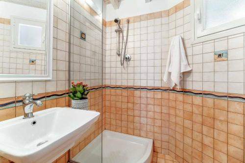a bathroom with a sink and a toilet at Villa Elpida in Sivota