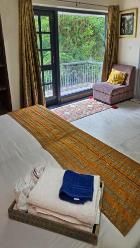Katil atau katil-katil dalam bilik di Prakash Kutir B&B